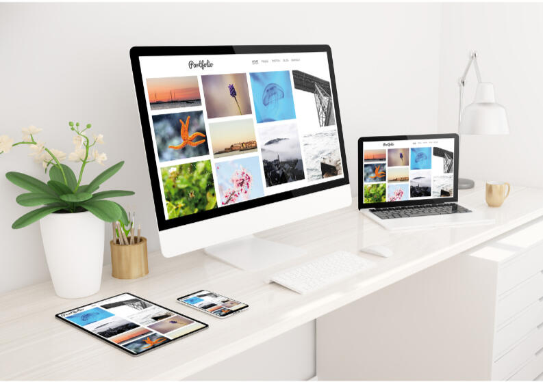 Check out my writing portfolio. A laptop, desktop, and mobile device with a writing portfolio on the screen.